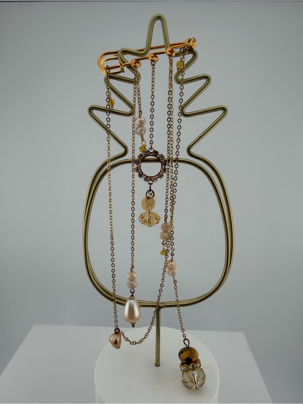Unique decorative gold-tone safety pin brooch